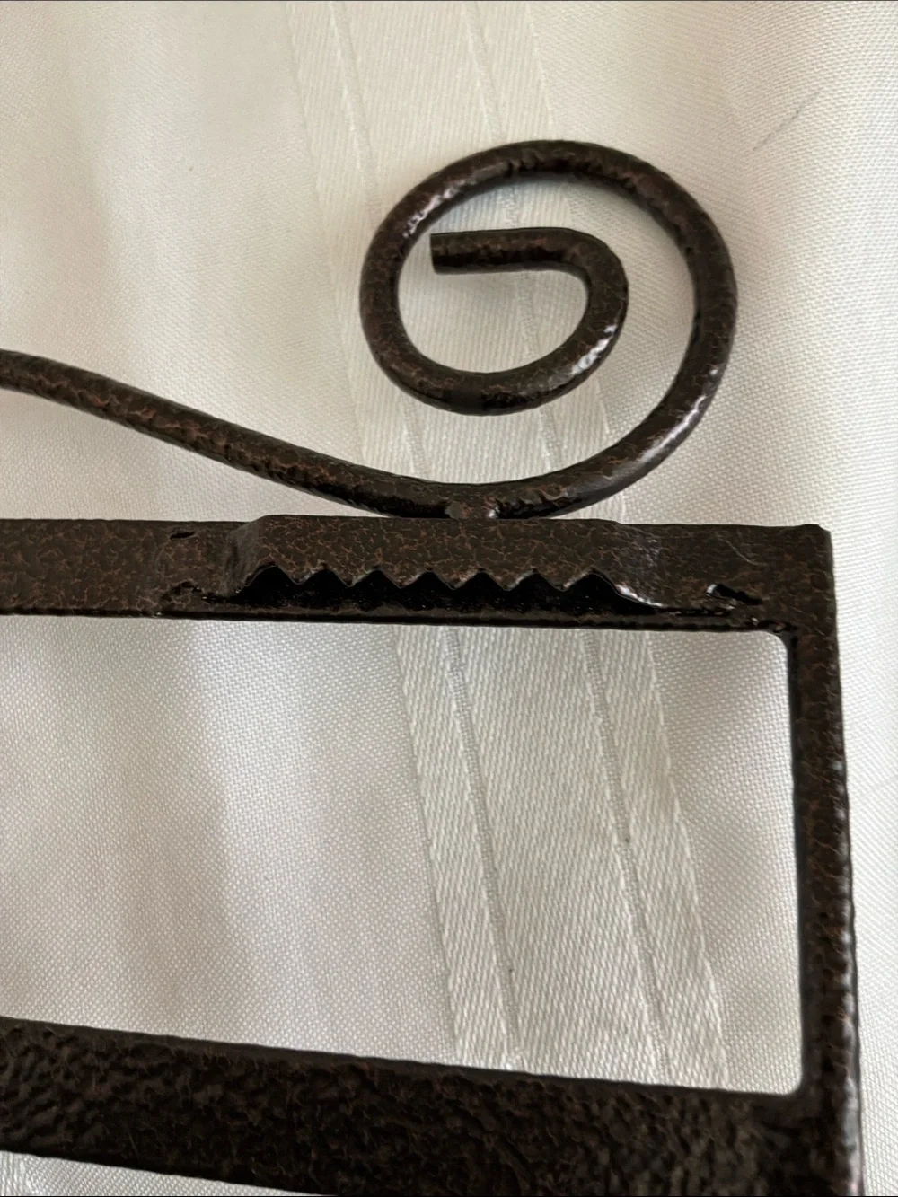 Decorative Brown Metal Wall Rack with Scroll Design